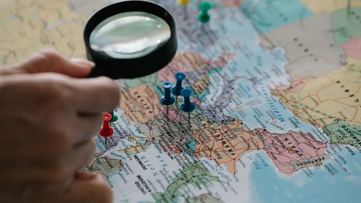 Bulk AI content generation for location pages and local SEO magnifying glass over a map with location pins