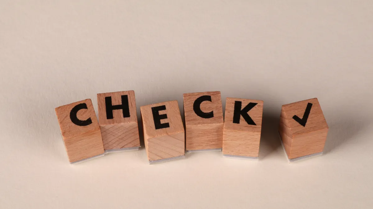 Plagiarism and originality checks for bulk AI content: workflows, tools, and thresholds Plagiarism and originality checks for bulk AI content: workflows, tools, and thresholds — Wooden Blocks Spelling 'Check'